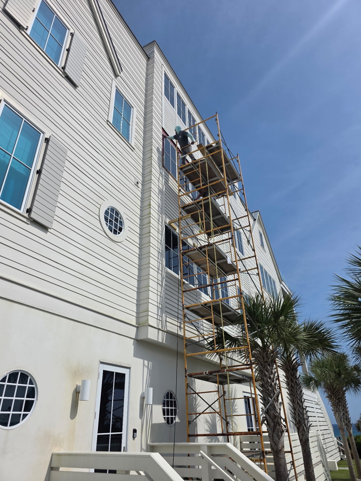 Beachfront home siding and trim repair from scaffolding