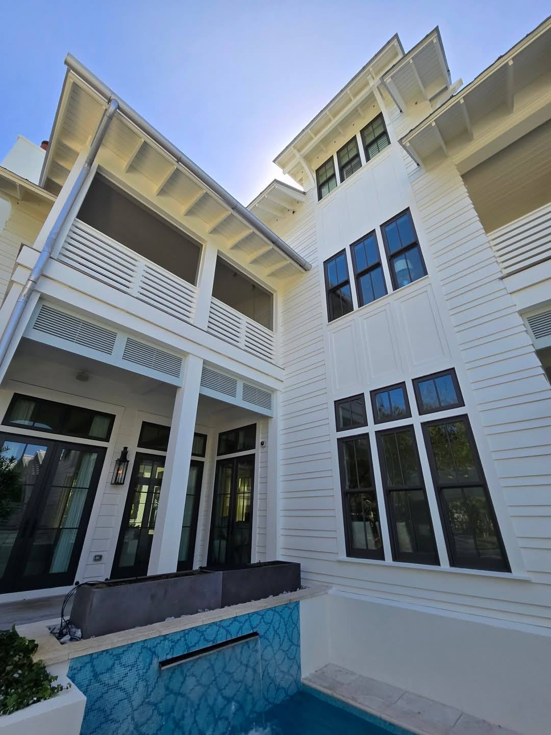 Coastal new home construction with pool by Essential Construction in Santa Rosa Beach Florida