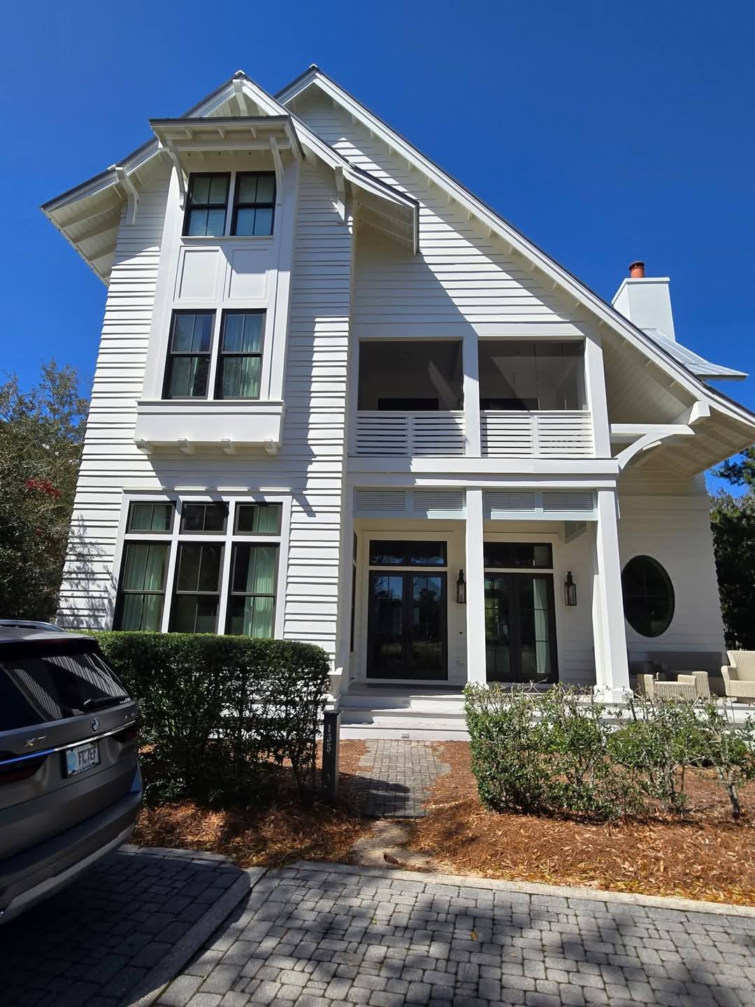 Coastal home with steep gable and metal roof