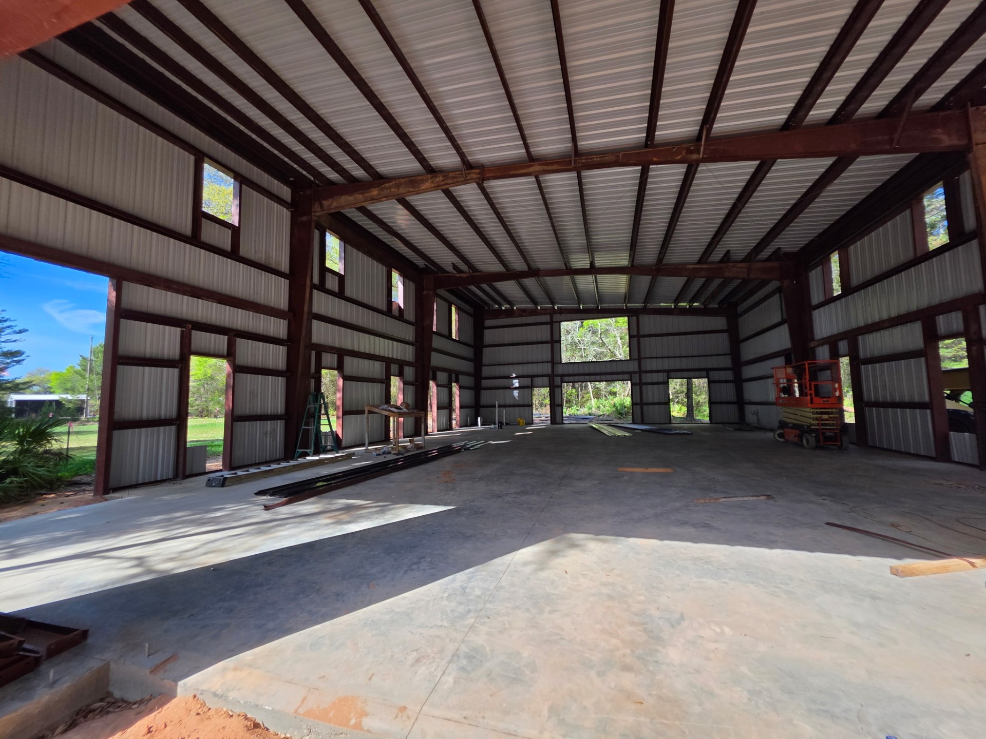 Interior of large steel pole barn with exposed framing